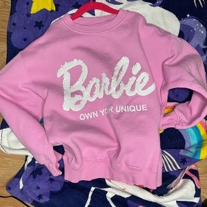 Im selling a pink Zara sweatshirt with the word Barbie in white sequins